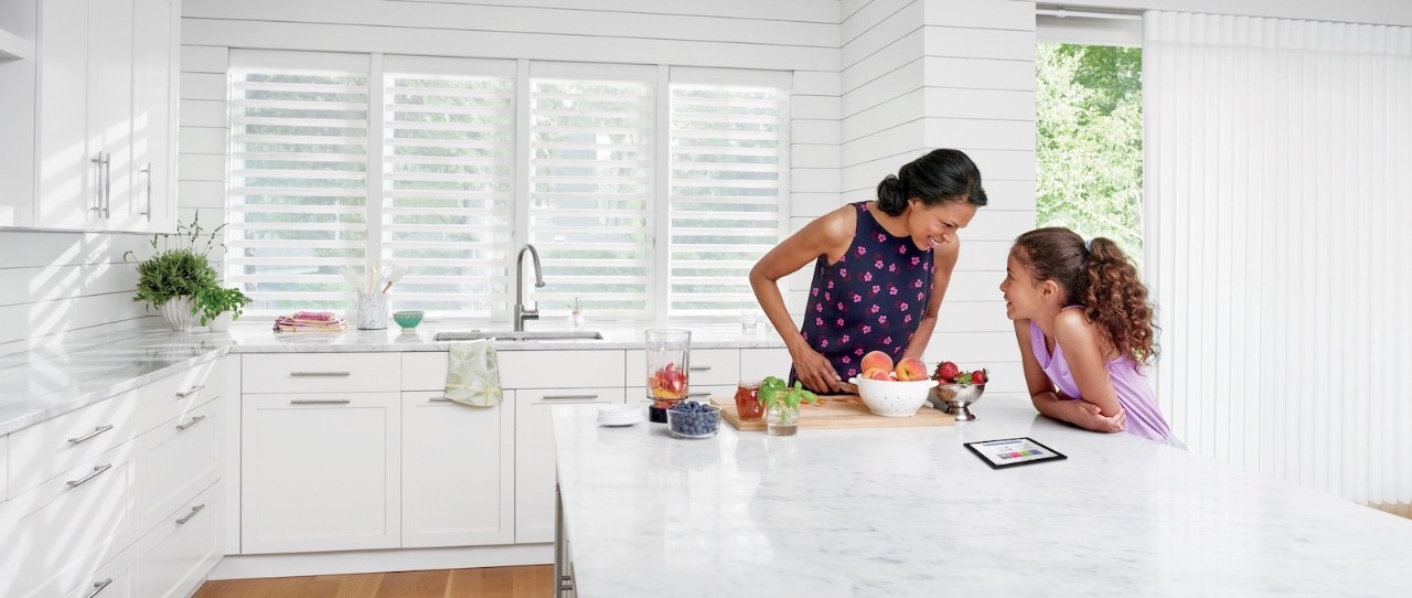 A kitchen island with marble top.